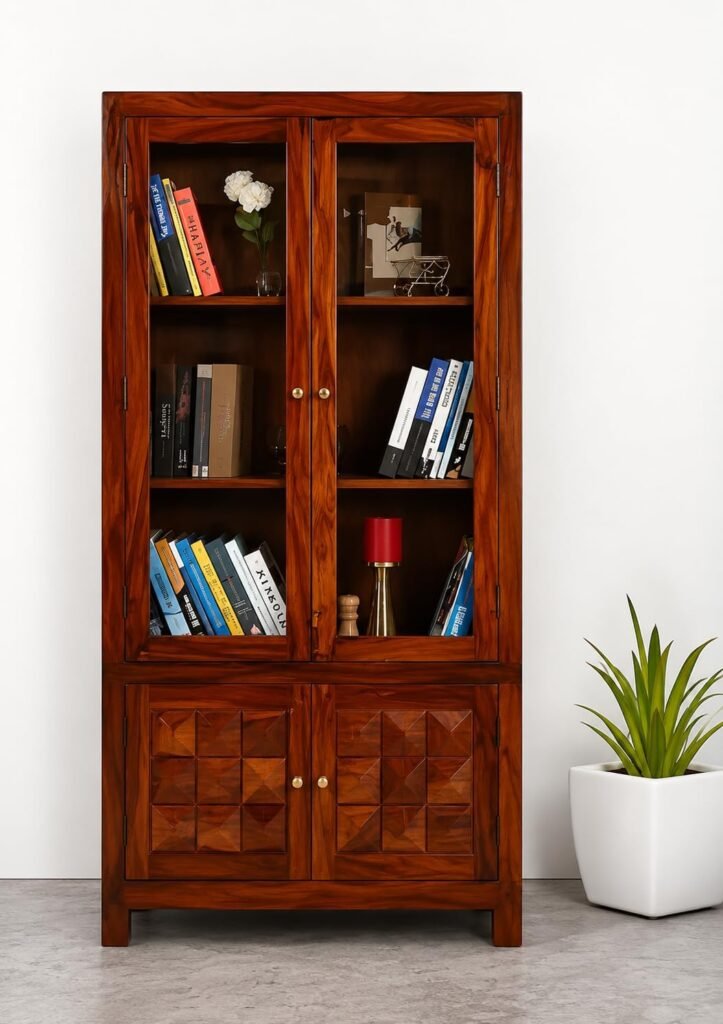 Sheesham wood bookshelf with glass doors and diamond-carved lower storage doors in teak finish, front view